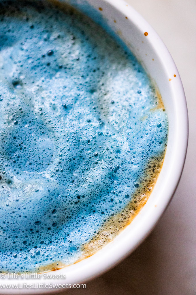 blue frothy milk with espresso