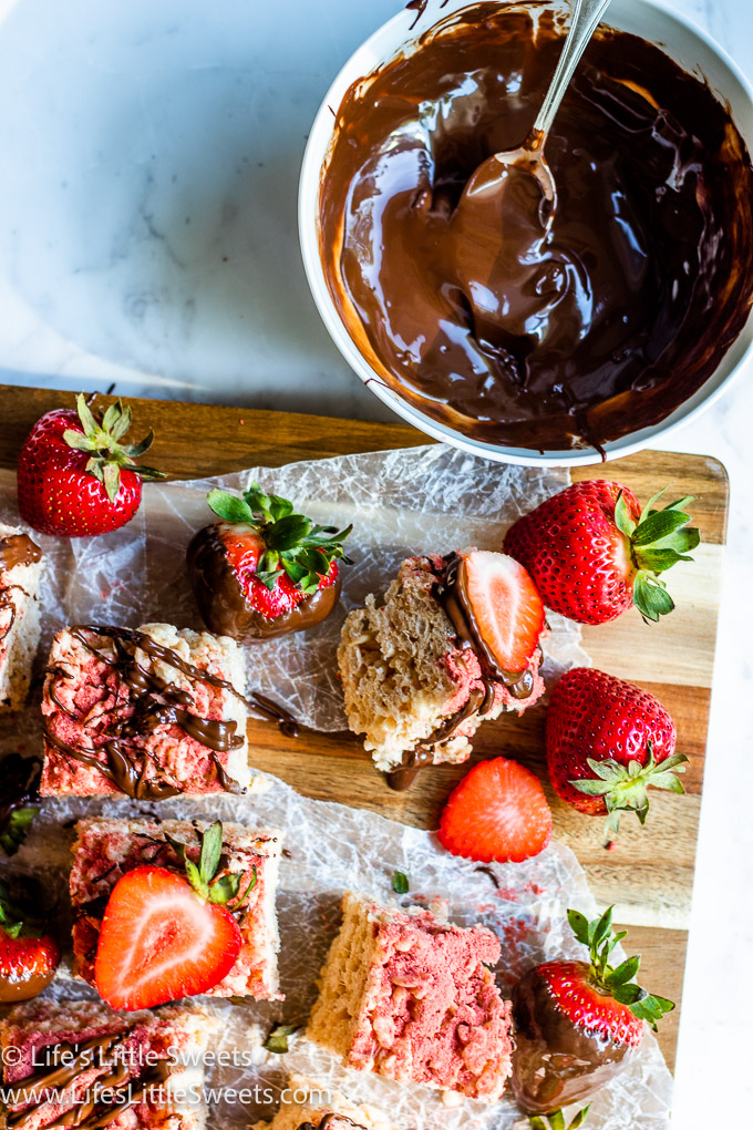Strawberry Rice Krispie Treats with a bowl of melted chocolate