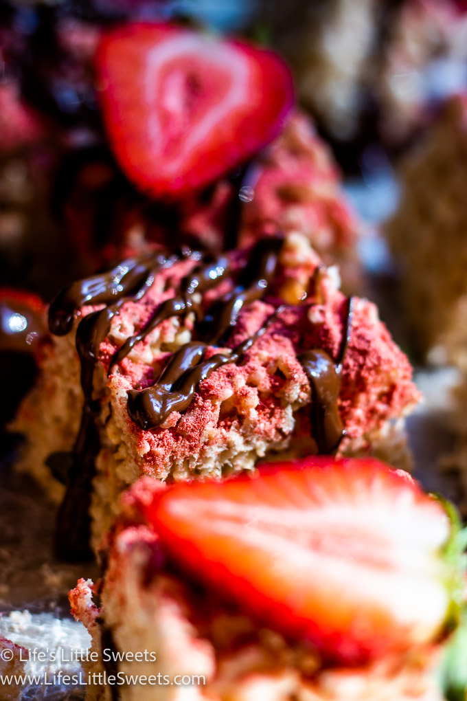 a close up of Strawberry Rice Krispie Treats with chocolate and strawberries