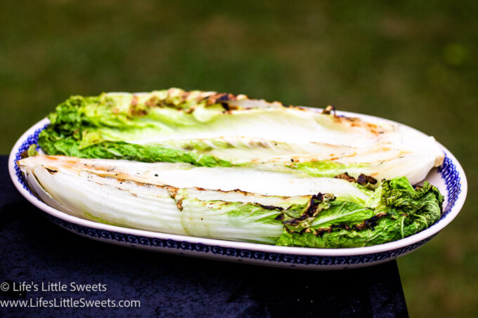 horizontal photo of grilled cabbage on a serving platter