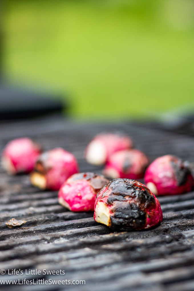 cooked radishes on a black grill