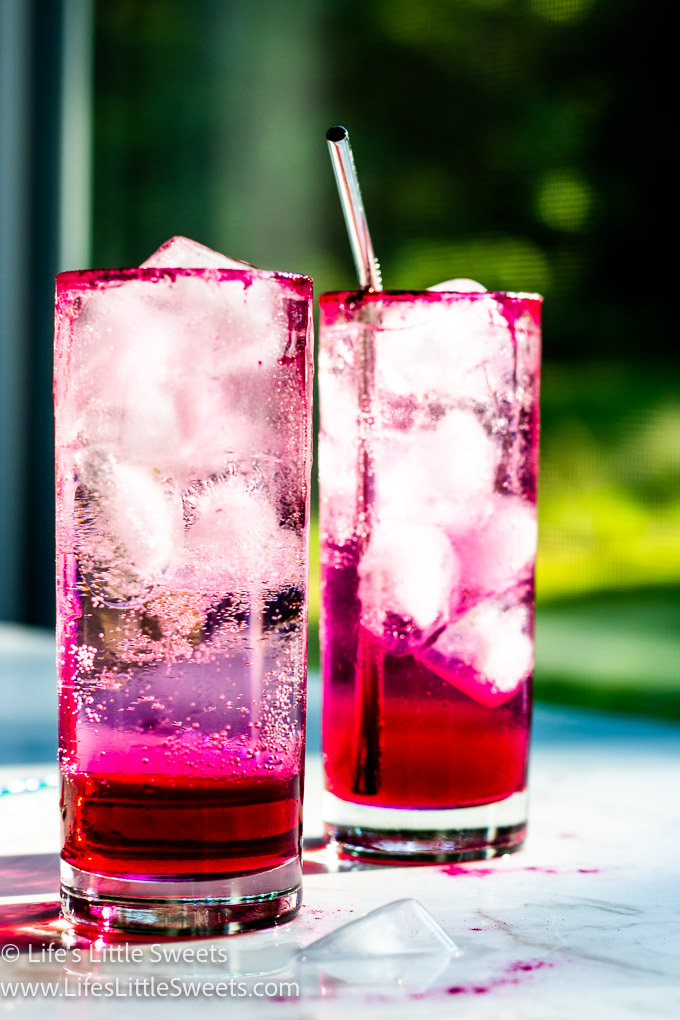 2 pink icy cold drinks on a marble table