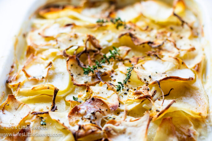 baked Scalloped Potatoes with fresh thyme on top