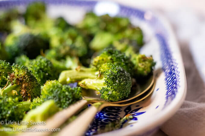 gold spoons holding cooked broccoli