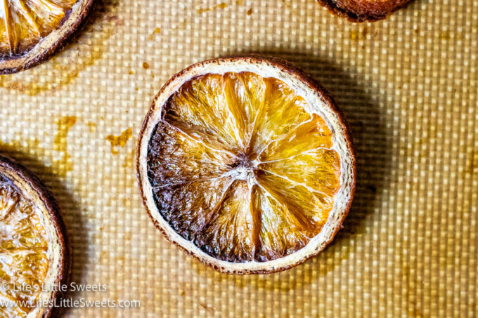 an up close view of a dry orange slice on a baking mat