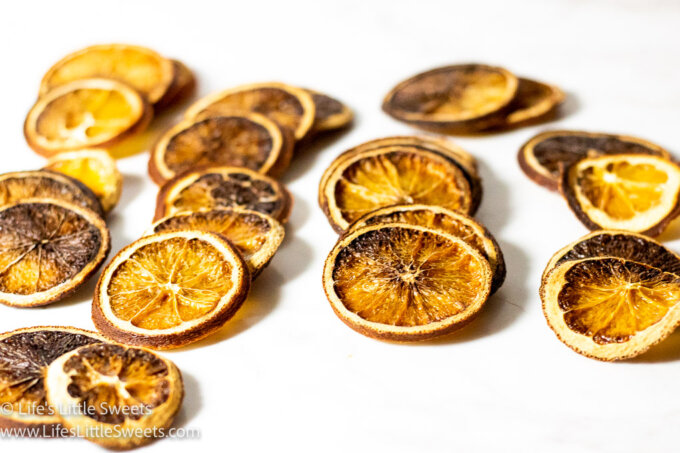 many dried orange slices on a white surface