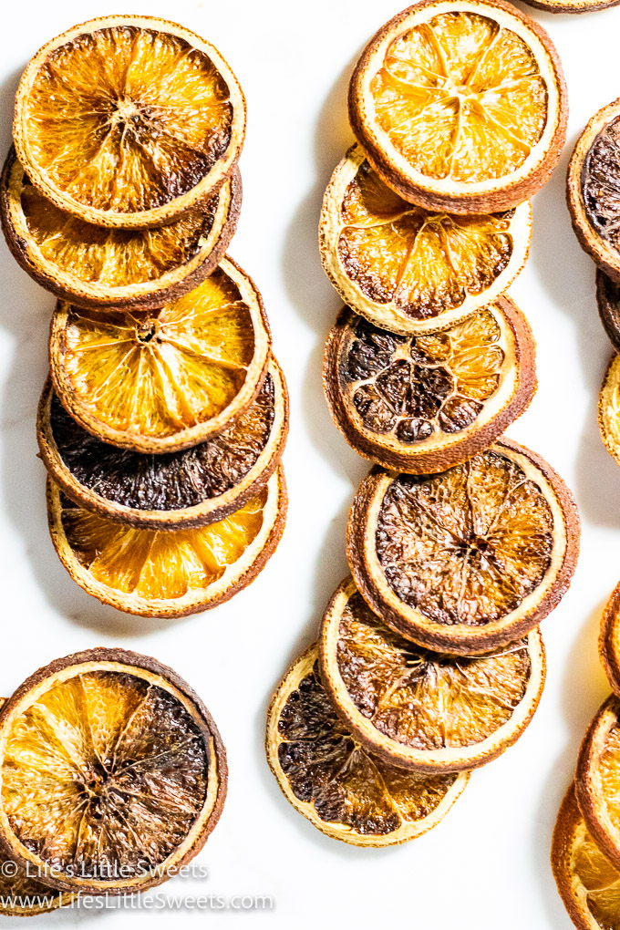 dried orange slices on a white surface