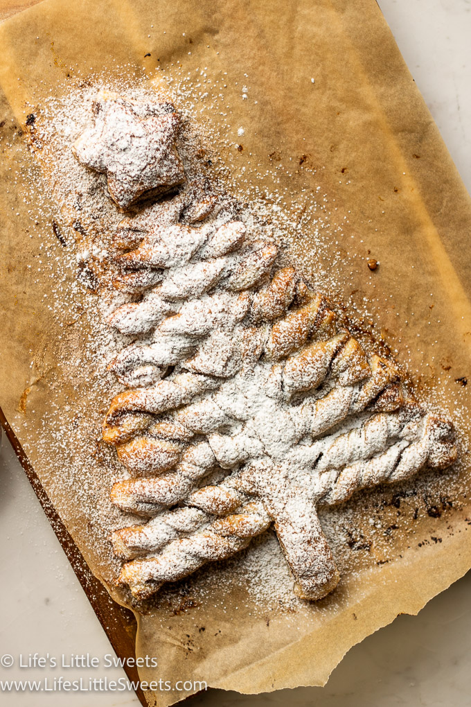 a Christmas tree puff pastry dessert dusted with powdered sugar