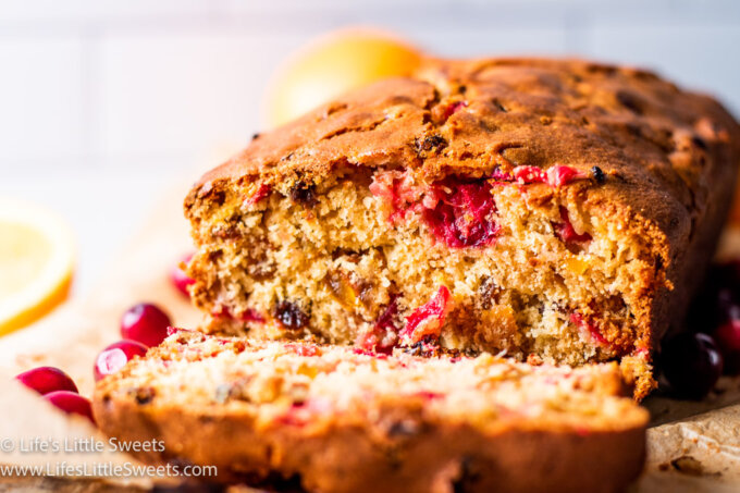 cranberry bread with oranges with a white subway tile backround