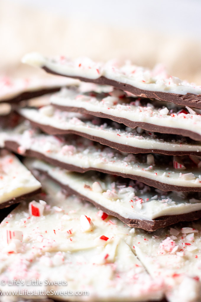 a big stack of peppermint bark with crushed candy canes