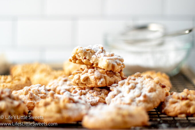 Pignoli cookies with a dusting of powdered sugar