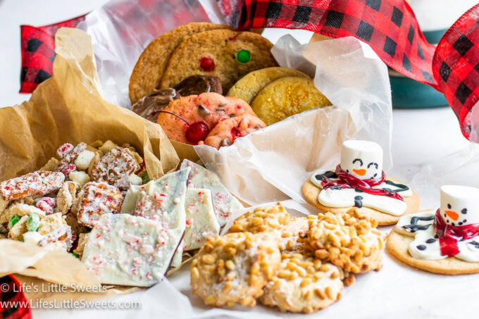 a table of a variety of cookies for the holidays