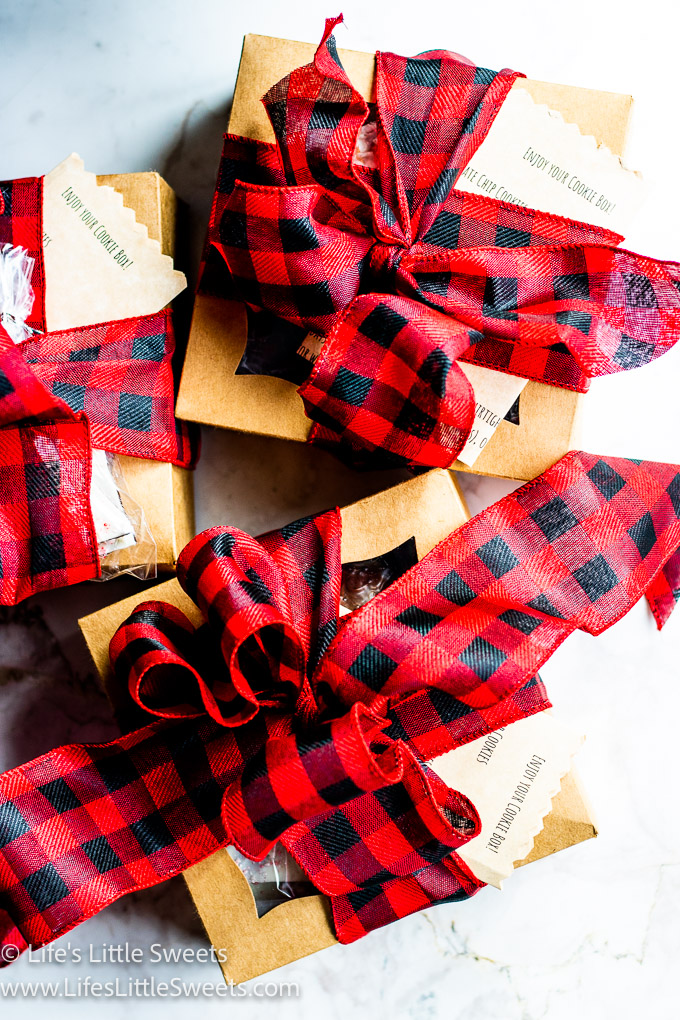 Cookie boxes with red checkered fabric ribbon with notes