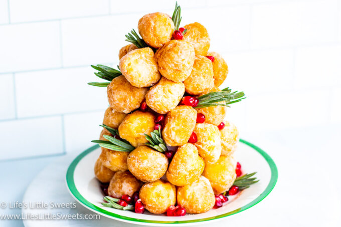 a donut tree with fresh lavender sprigs with pomegranate arils on a Christmas plate