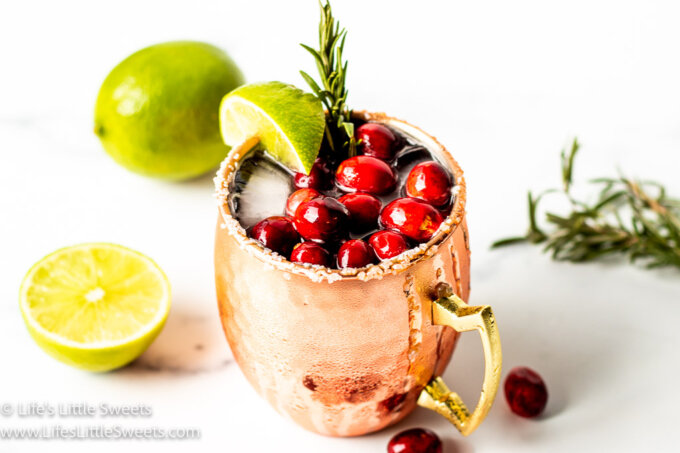 a cold drink with fresh cranberries