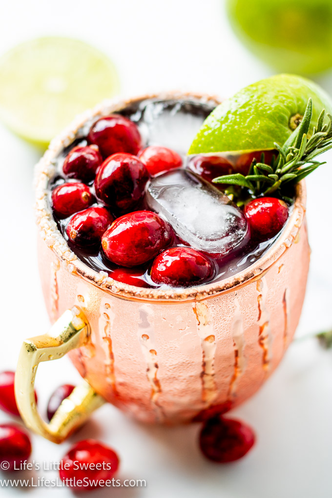 a holiday gin mule drink in a copper mug 