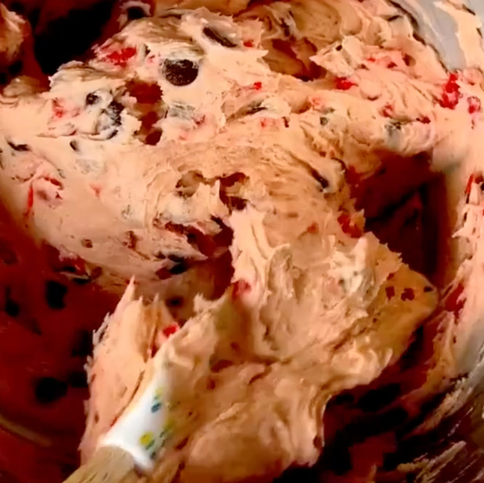 folding in chocolate into cookie dough
