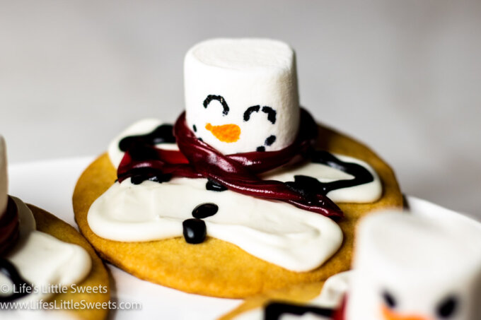 a cookie decorated like a melting snowman