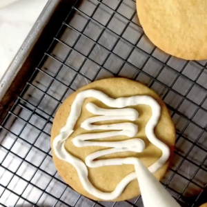 frosting a sugar cookie