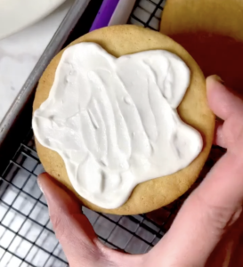 a white frosted sugar cookie