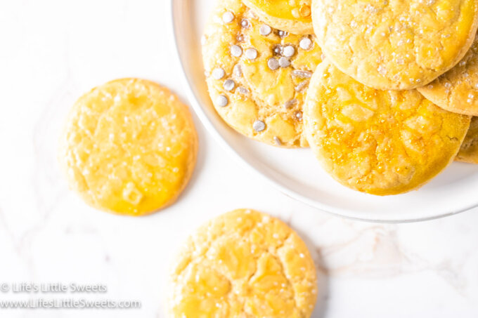 sugar cookies with silver and gold sprinkles on a white background