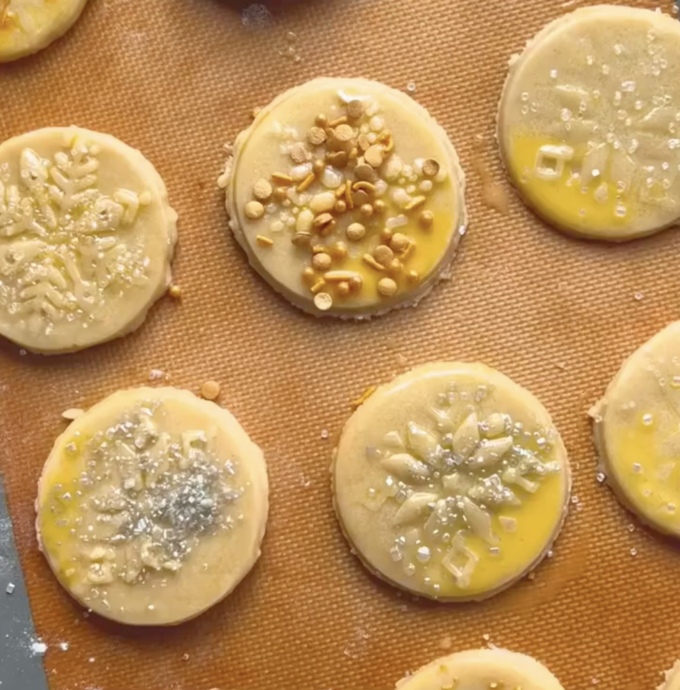 sprinkles on unbaked stamped sugar cookies