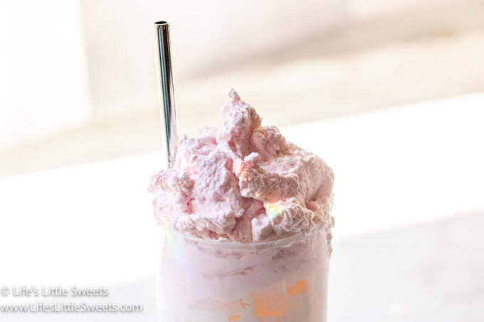 a photo of pink whipped cream on milk