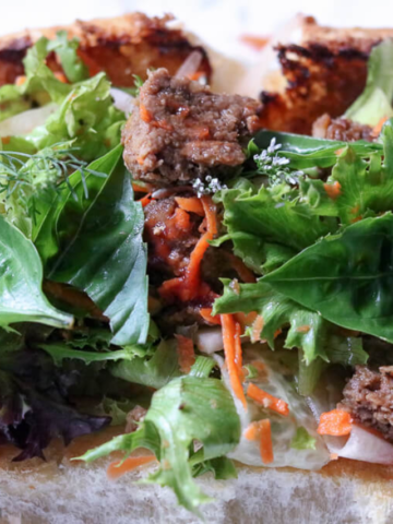 DELICIOUS TOASTED VEGETARIAN BURGER MIXED GREENS SALAD SANDWICH STORY Poster Image