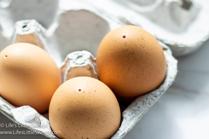 a close up of brown farm eggs that have been blown-out