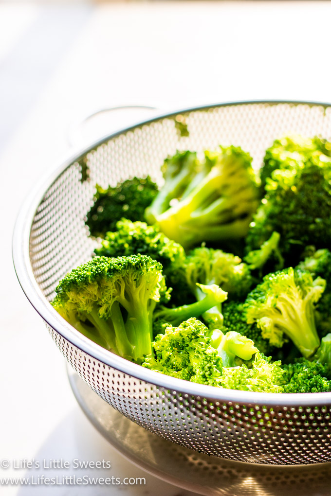 parboiled broccoli in a colander  