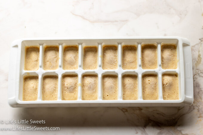 frozen pancake batter in a white ice cube tray