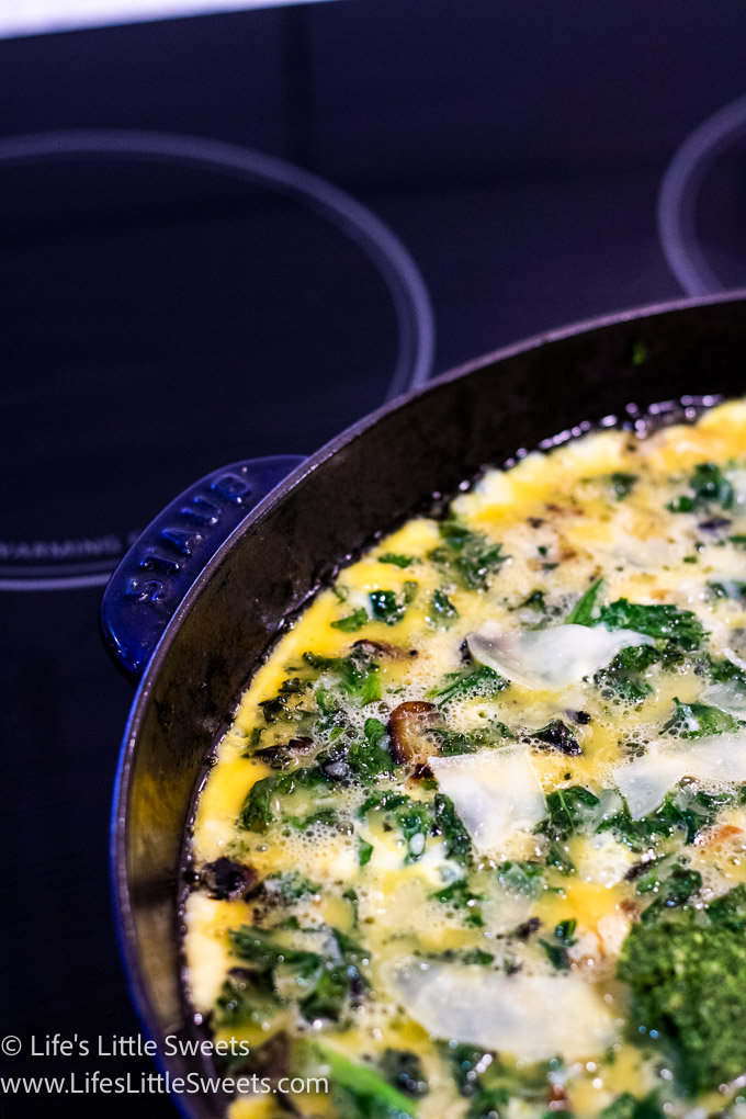 a cast iron skillet with a cooked kale Frittata