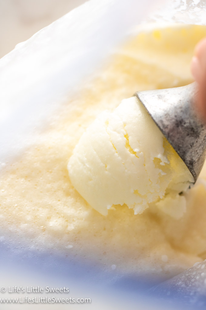 scooping plain vanilla ice cream