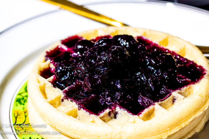 waffles topped with blueberry syrup