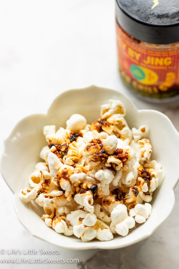 a small white bowl Popcorn with Chili Crisp