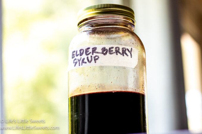 Elderberry syrup in a clear, glass jar