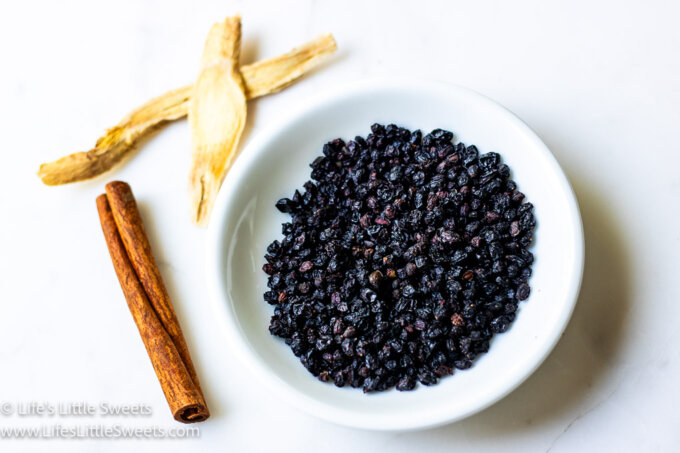 ingredients for Elderberry syrup on a white background