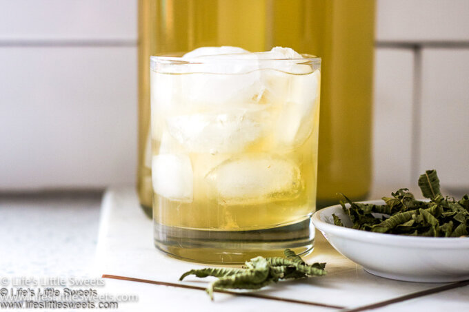 Lemon Verbena Kombucha in a clear glass on a kitchen counter