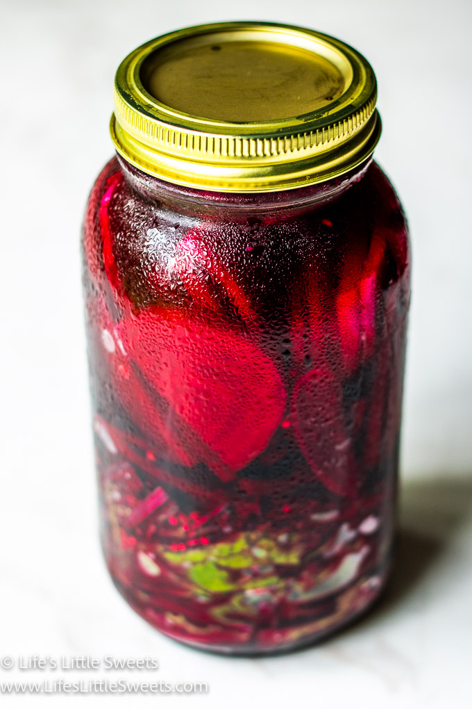 a large jar of red pickled beets