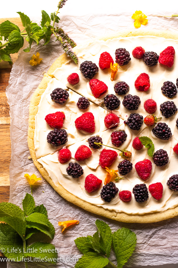 fruit pizza with fresh berries on top with fresh mint