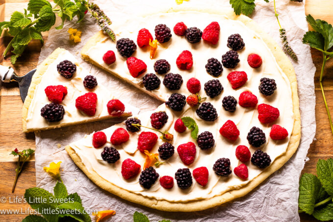 a round fruit pizza with fresh berries on top