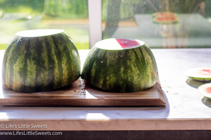 a cut fresh watermelon on a marble table in the afternoon sunlight