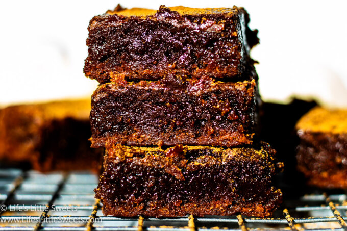 a stack of brownies on a cooling rack