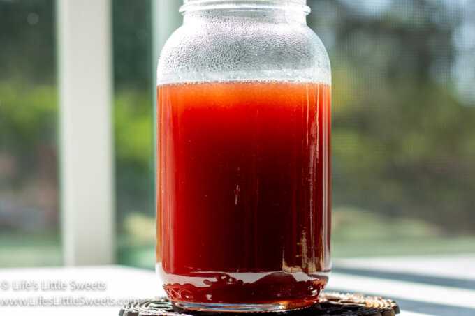 Strawberry Simple Syrup Recipe in a mason jar