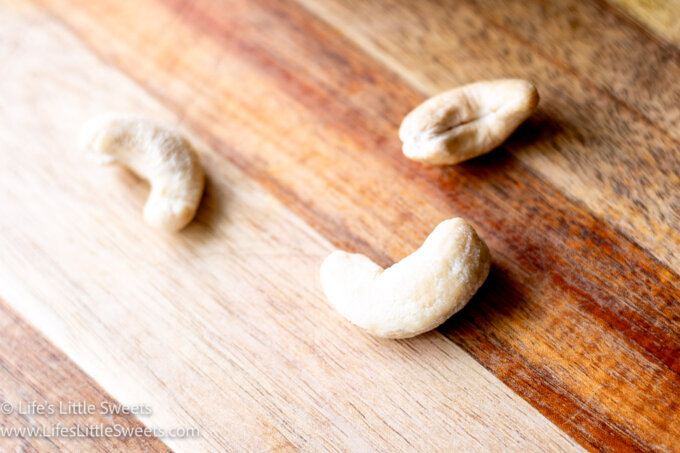 cashews on a wood cutting board