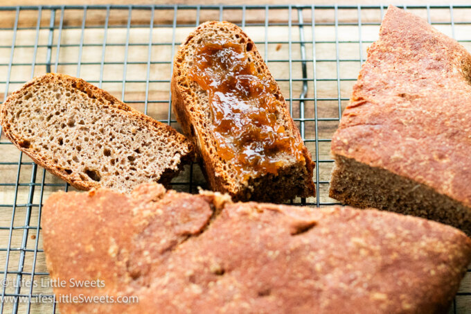 No Knead Whole Wheat Bread sliced on a cooling rack
