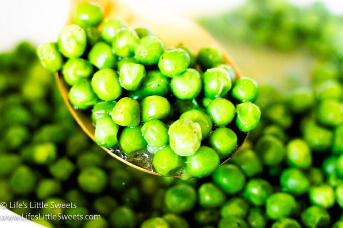 Slow Cooker Crock Pot Butter Green Peas in a gold spoon