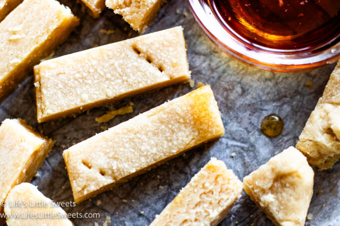 Maple Shortbread Cookies with a bowl of maple syrup