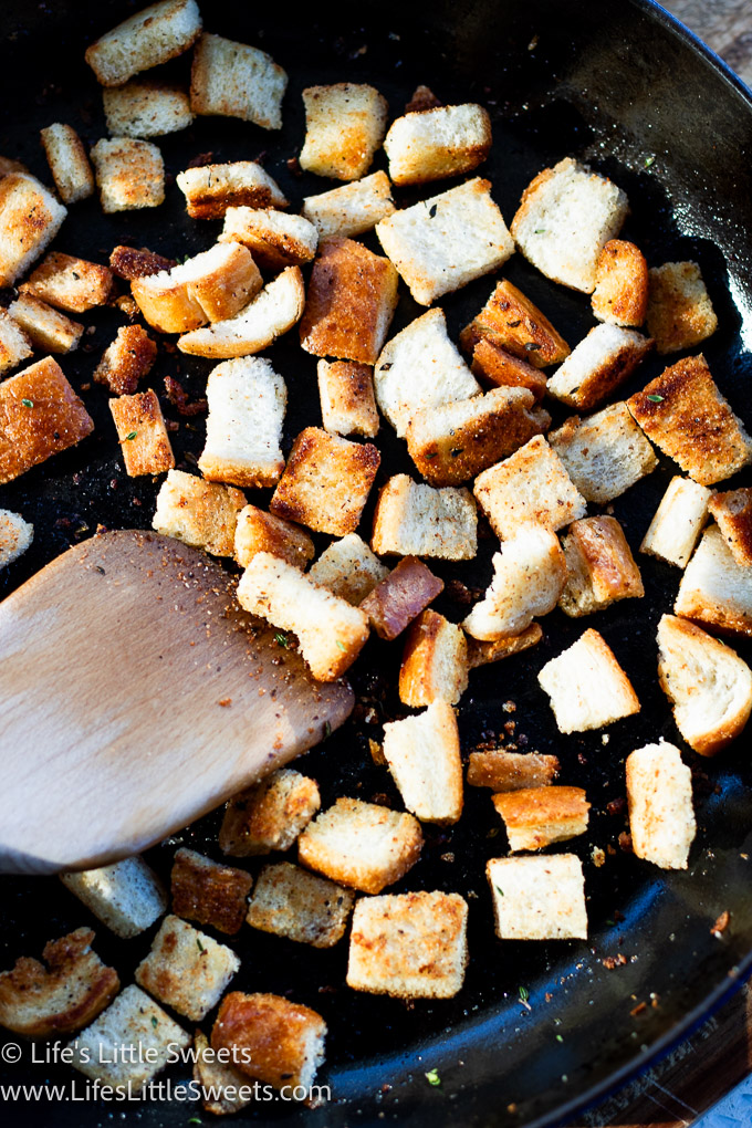 homemade croutons in a cast iron pan