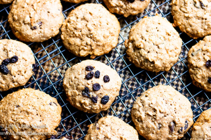 several oatmeal cookies cooling on top of a wire rack